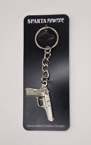 Sparta Pewter 9mm keychain on a black card with brand name.
