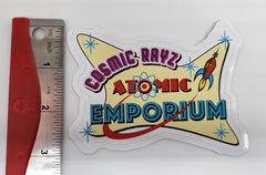Pegatina grande con el logotipo de Atomic Emporium de Cosmic Rayz