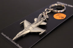 Llavero de peltre con el avión de combate F-16 de General Dynamics