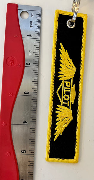 Llavero bordado de piloto con alas doradas