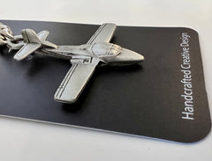 Llavero de peltre con el mensaje Tweet de Cessna T-37